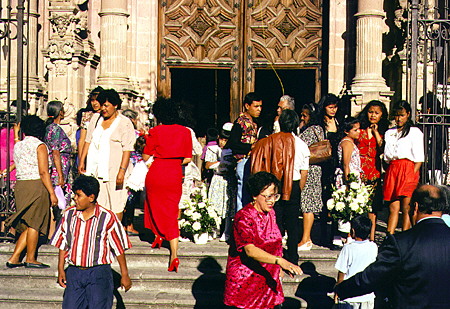 Crowd of people attending church in Taxco. Mexico.