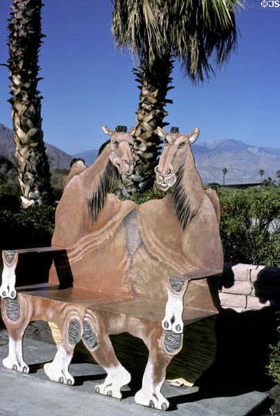 Bench with camel shapes at Palm Springs tourist office. CA.