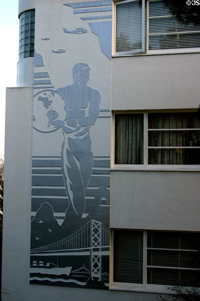 Mural of stevedore holding globe above Bay Bridge & ship with three clipper airships overhead on Mallock Apartments. San Francisco, CA.