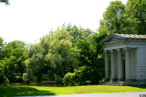 Crane tomb beside landscape pond in Graceland Cemetery. Chicago, IL.