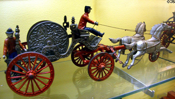 Toy horse-drawn fire hose carriage (c1890-6) at Museum of the City of New York. New York, NY.