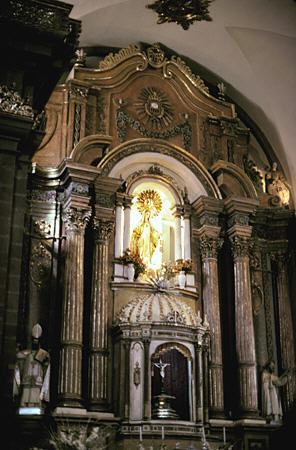 Side altar inside La Merced church, Cusco. Peru.