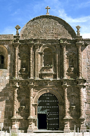 Baroque carved main portal of Dominican Church in Pomata. Peru.