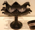 Etruscan black ceramic Bucchero Ware stand with profile of horses at Royal Ontario Museum. Toronto, ON.