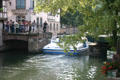 Boat navigates locks of Petite France area of L'Ill River. Strasbourg, France.