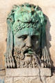 Fountain bronze face with lion headdress by Antoine Laurent Dantan on Arles Obelisk pedestal. Arles, France