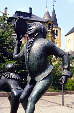 Statue of man with tambourine in city of Luxembourg.