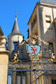 Ornate gilded ironwork with civil ensign on gate to Grand Ducal Palace. Luxembourg, Luxembourg.