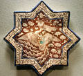 Earthenware fritware star-shaped tile with phoenix from Iran at Asian Art Museum. San Francisco, CA