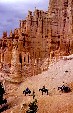 Horse riders pass hoodoos in Bryce Canyon National Park. UT