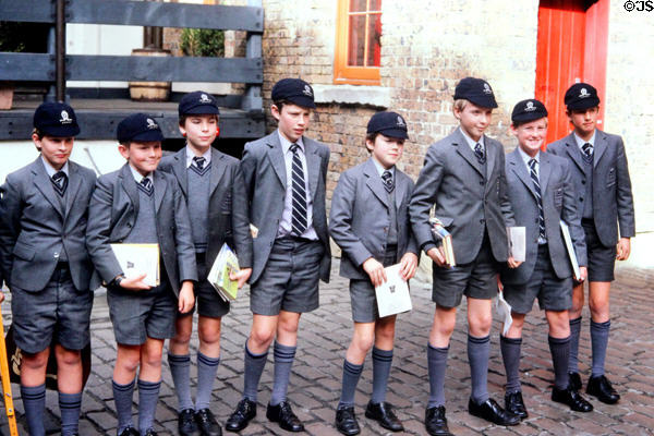 Uniformed school boys line up on a street. Sydney, Australia.