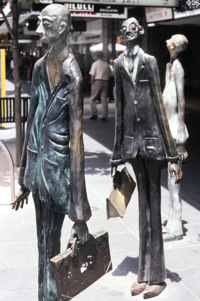 Three Businessmen who brought their own lunch sculpture (1994) by Alison Weaver & Paul Quinn on corner of Bourke & Swanston Streets. Melbourne, Australia.