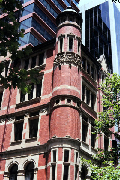 Round tower corner of a red brick building at Bourke & Church Streets in Melbourne. Melbourne, Australia.