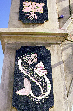 Dolphin relief on Independence Arch. Bridgetown, Barbados.