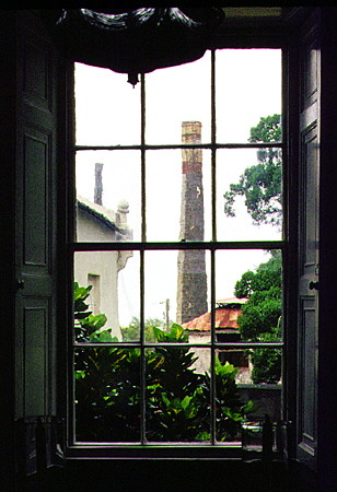 View of old sugar mill of St Nicholas Abbey through the dining room windows. Barbados.