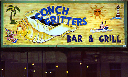 Sign for conch fritters, popular local dish, served everywhere & The Bahamas. Nassau, The Bahamas.