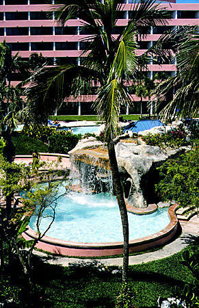 Pool & palms of Radisson Resort on Cable Beach. The Bahamas.