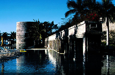 Pool with replica of sugar mill tower & aqueduct at Our Lucaya Resort hotel on Grand Bahama Island. The Bahamas.