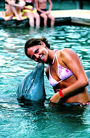 Unexso Dolphin Experience where visitors commune with these mammals. The Bahamas.