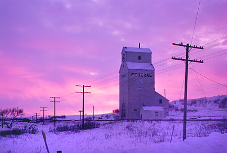 Winter sunrise over a typical Alberta grain elevator. AB.