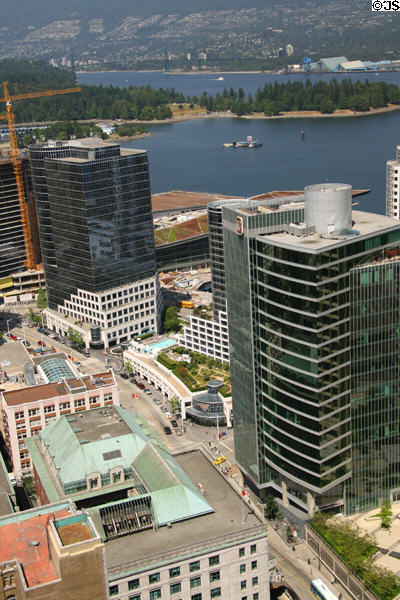 Stanley Park over Waterfront Centre, Fairmont Waterfront Hotel & Pricewaterhouse Coopers Place. Vancouver, BC.