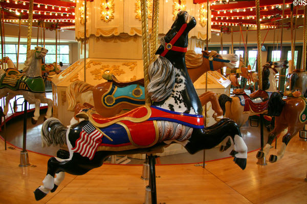 Horse with American flag on C.W. Parker Carousel at Burnaby Village Museum. Burnaby, BC.