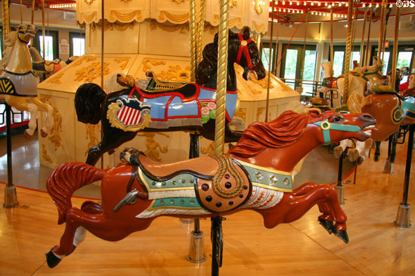 Brown horse with dog on C.W. Parker Carousel at Burnaby Village Museum. Burnaby, BC.