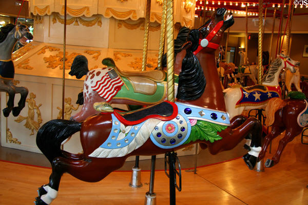 Brown horse with fish on C.W. Parker Carousel at Burnaby Village Museum. Burnaby, BC.