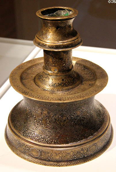 Inlaid brass candlestick (late13thC - early 14thC) from western Iran at Aga Khan Museum. Toronto, ON.