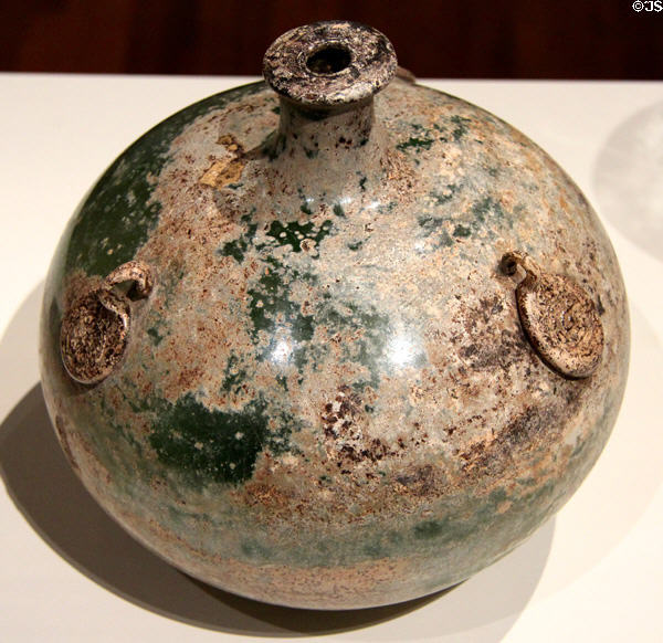 Glass flask (11thC) signed with seals in imitation of those used on ceramic flasks prob. from Iran at Aga Khan Museum. Toronto, ON.