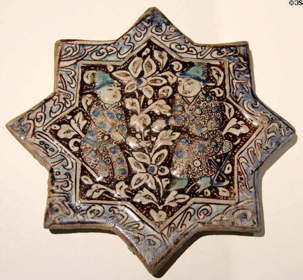 Fritware tile painted blue & brown with two men (early 14thC) from Iran at Aga Khan Museum. Toronto, ON.