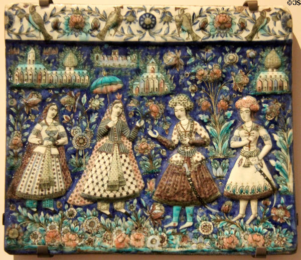 Fritware tile embossed & painted with Iranians in traditional dress of 1600s (2nd half 19thC) from Tehran, Iran at Aga Khan Museum. Toronto, ON.