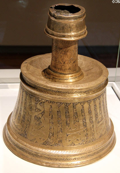 Brass candlestick (early 14thC) made for an amir of al-Malik an-Nasir of Egypt at Aga Khan Museum. Toronto, ON.
