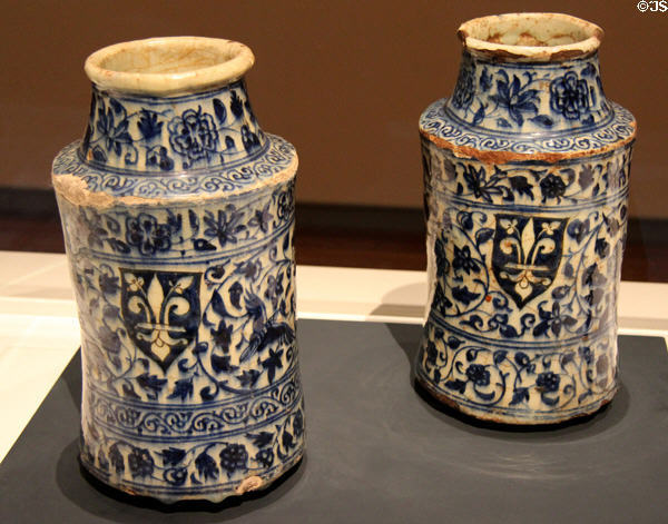 Fritware pair of pharmacy jars (Albarrelli) painted with European armorial shields (15thC) from Syria at Aga Khan Museum. Toronto, ON.