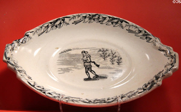 Earthenware transfer gravy boat stand with snowshoeing scene (1880s) by Bo'ness Pottery of Fife, Scotland at Gardiner Museum. Toronto, ON.
