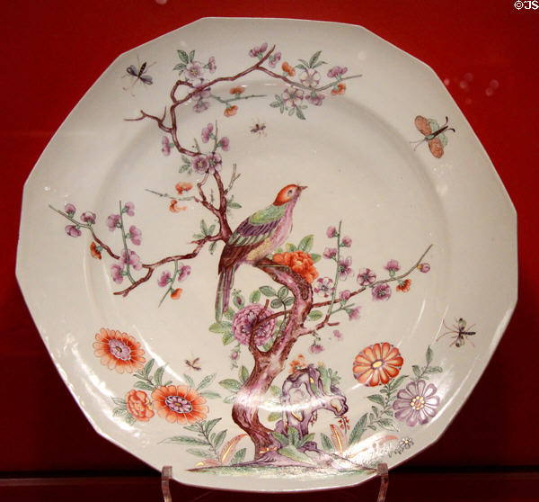 Porcelain charger painted with flowers & bird (c1722-23) by Du Paquier of Vienna, Austria at Gardiner Museum. Toronto, ON.