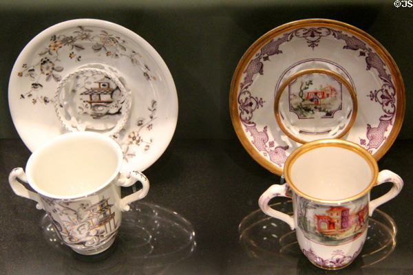 Porcelain chocolate cups with double handles & trembleuse saucers (c1730) by Du Paquier of Vienna, Austria at Gardiner Museum. Toronto, ON.