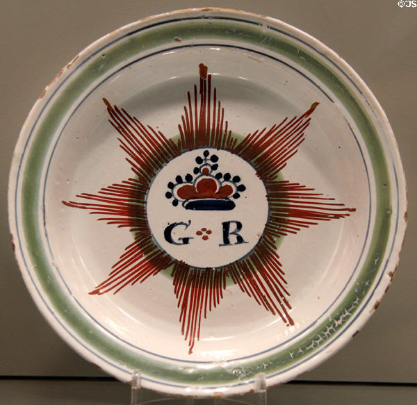 George I or II commemorated on English delftware dish (1714-35) prob. from Bristol at Gardiner Museum. Toronto, ON.