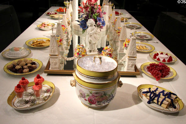 Porcelain dessert table setting (c1796-1805) by Derby around Sevres centerpiece at Gardiner Museum. Toronto, ON.