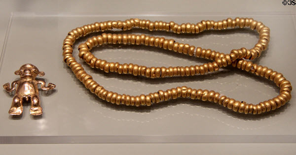 Costa Rica cast gold figure pendant (700-1550) & gold bead necklace from Costa Rica or Panama (700-1550) at Gardiner Museum. Toronto, ON.
