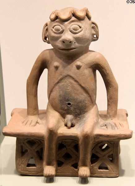 Carchi earthenware seated male figure on bench (1100-1400) from Ecuador at Gardiner Museum. Toronto, ON.