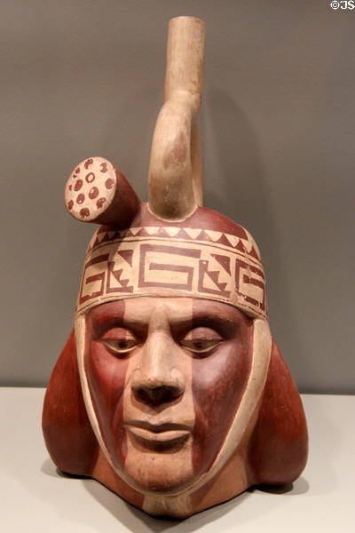 Moche culture earthenware portrait bottle with stirrup spout (100-700) from North Coast Peru at Gardiner Museum. Toronto, ON.