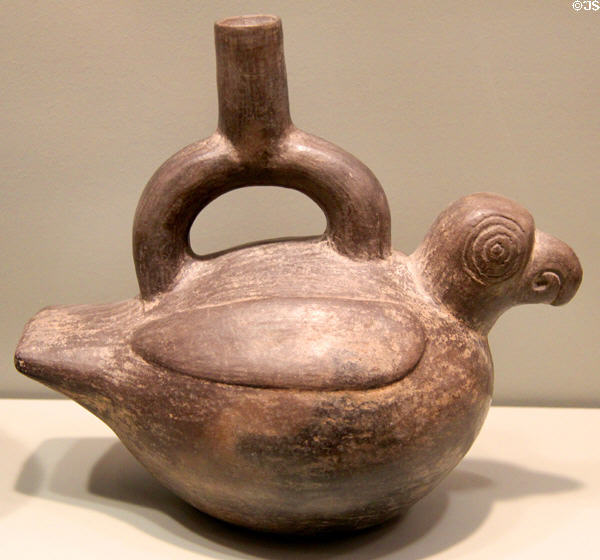 Chimu culture earthenware macaw effigy bottle with stirrup spout (1000-1470) from North Coast Peru at Gardiner Museum. Toronto, ON.