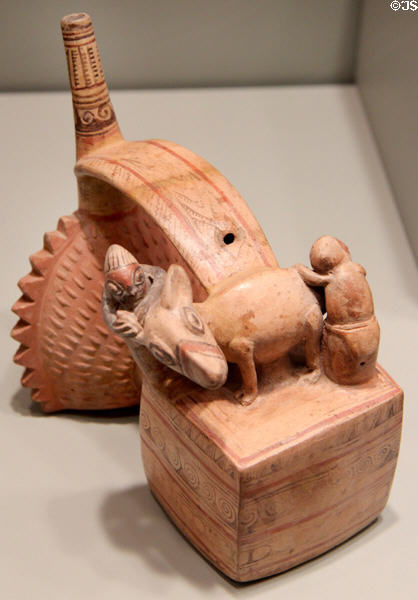 Sicán (aka Lambayeque) earthenware whistling bottle with double chambers shaped like thorny oyster & llama with two attendants (800-1100) from North Coast Peru at Gardiner Museum. Toronto, ON.