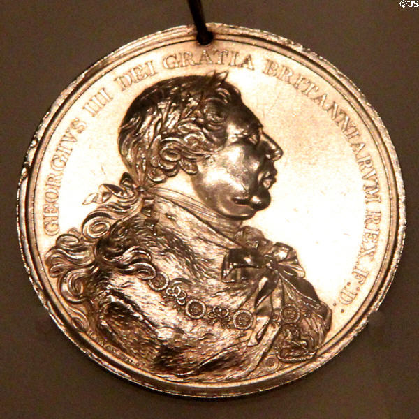 Silver Indian peace medal with portrait of King George III marking end of War of 1812 made (1814) in London at Royal Ontario Museum. Toronto, ON.