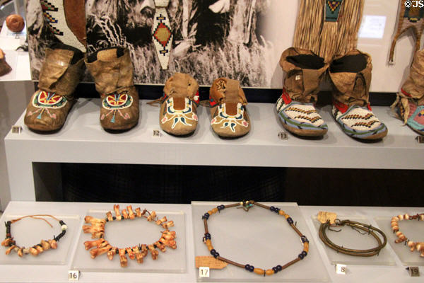 Alberta Blackfoot tribal moccasins, boots & necklaces (late 19thC) at Royal Ontario Museum. Toronto, ON.