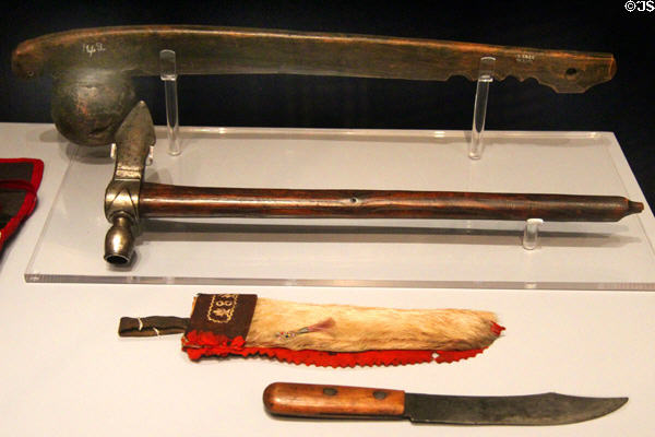 Ojibwe ball-headed club with animal effigy, tomahawk pipe plus knife & scabbard (19thC) at Royal Ontario Museum. Toronto, ON.