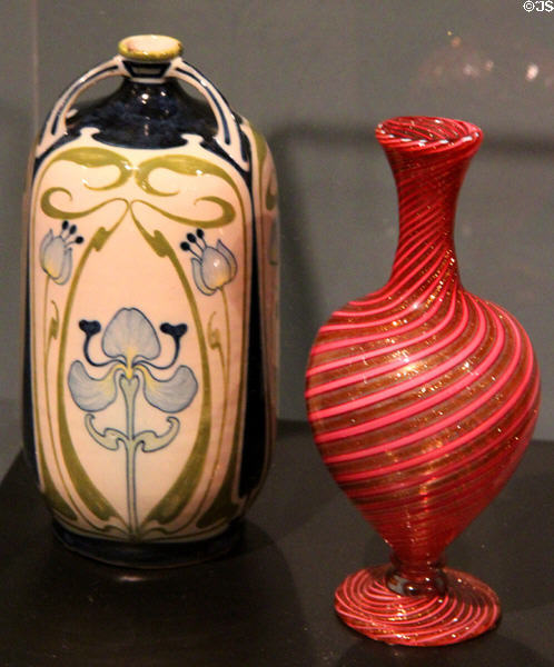Ceramic vase (c1900-06) by Galileo Chini for L'Arte della Ceramica, Florence, Italy & red glass vase (c1880-1920) by unknown in Murano, Italy at Royal Ontario Museum. Toronto, ON.