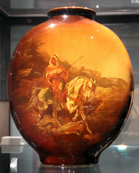 Earthenware vase in Utopian pattern (before 1906) by A.F. Best made by J.B. Owens Pottery of Zanesville, Ohio at Royal Ontario Museum. Toronto, ON.