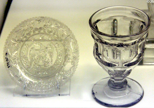 Pressed glass cup plate with American eagle (1831) & goblet (1855-65) from United States at Royal Ontario Museum. Toronto, ON.